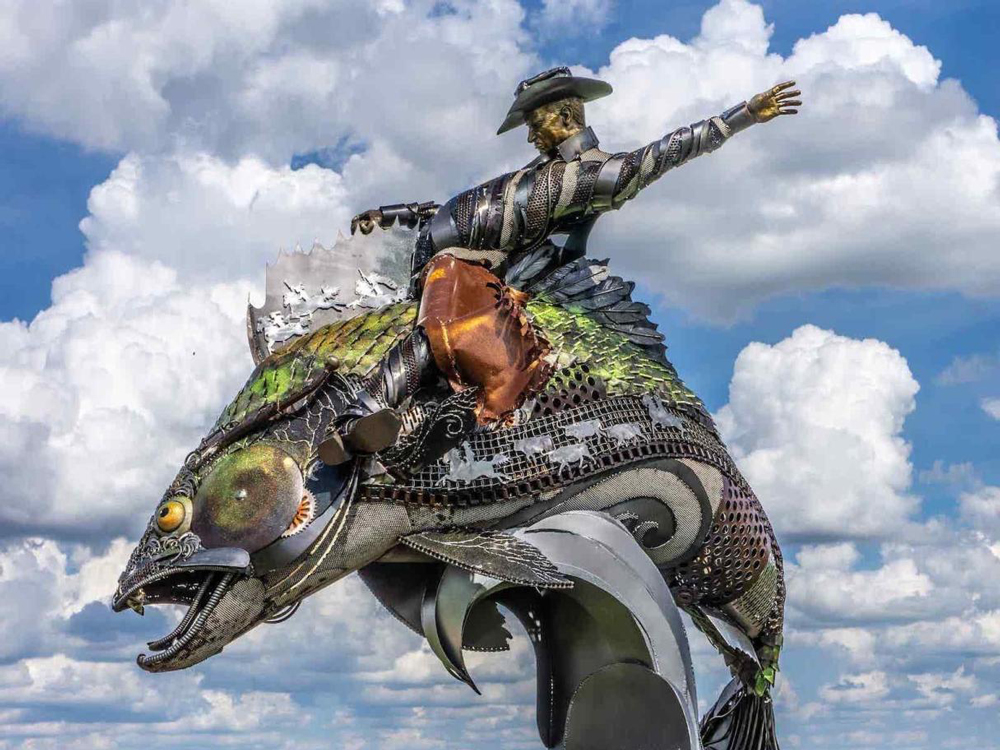 Cowboy Riding Fish Statue