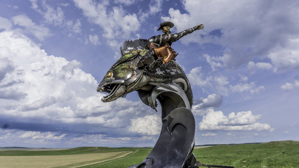 Cowboy Riding Fish Statue