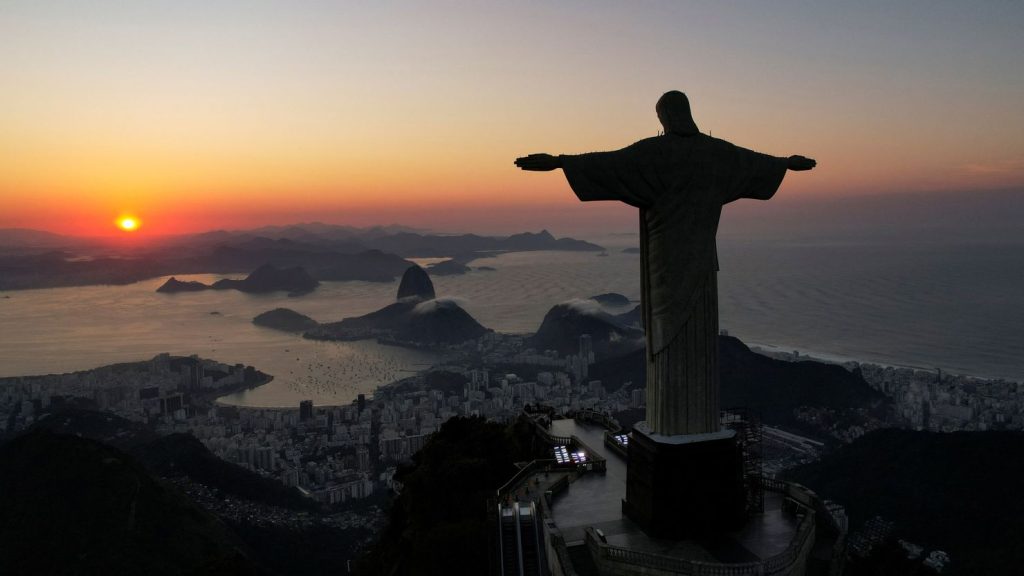 Christ the Redeemer statue overlooking Rio at sunrise